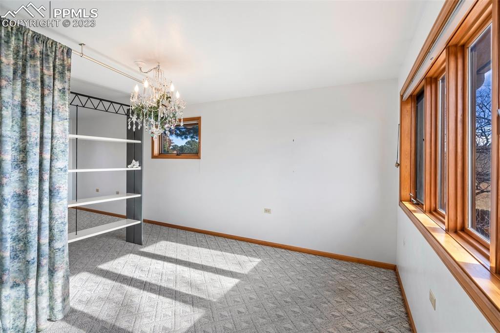1711 Columbine Road Colorado Springs, CO 80907 - Photo 17 of 50 a view of a livingroom with wooden floor and windows