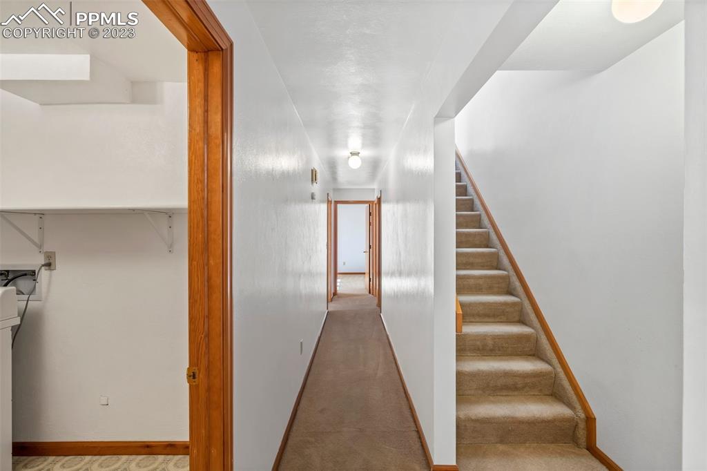 1711 Columbine Road Colorado Springs, CO 80907 - Photo 19 of 50 a view of a hallway with wooden floor and entryway