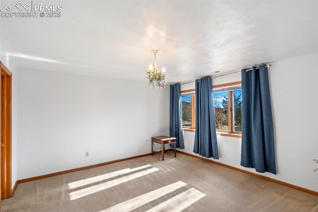 1711 Columbine Road Colorado Springs, CO 80907 - Photo 20 of 50 a view of a room with a chandeliers