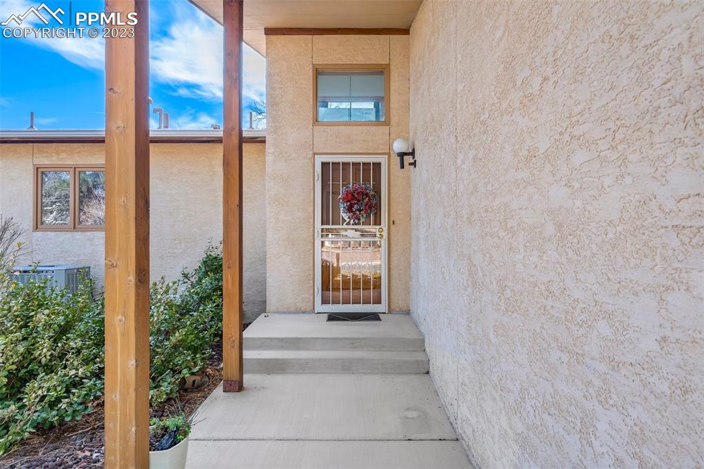 1711 Columbine Road Colorado Springs, CO 80907 - Photo 2 of 50 a front view of a house with a yard