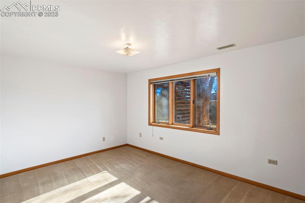 1711 Columbine Road Colorado Springs, CO 80907 - Photo 24 of 50 an empty room with a window
