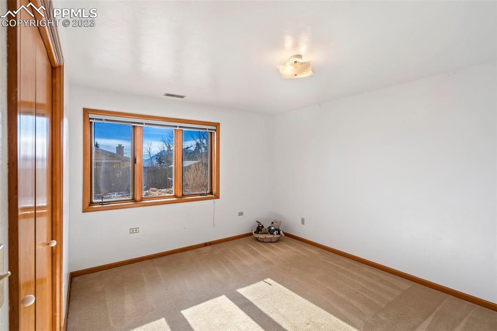 1711 Columbine Road Colorado Springs, CO 80907 - Photo 26 of 50 a view of an empty room with a window