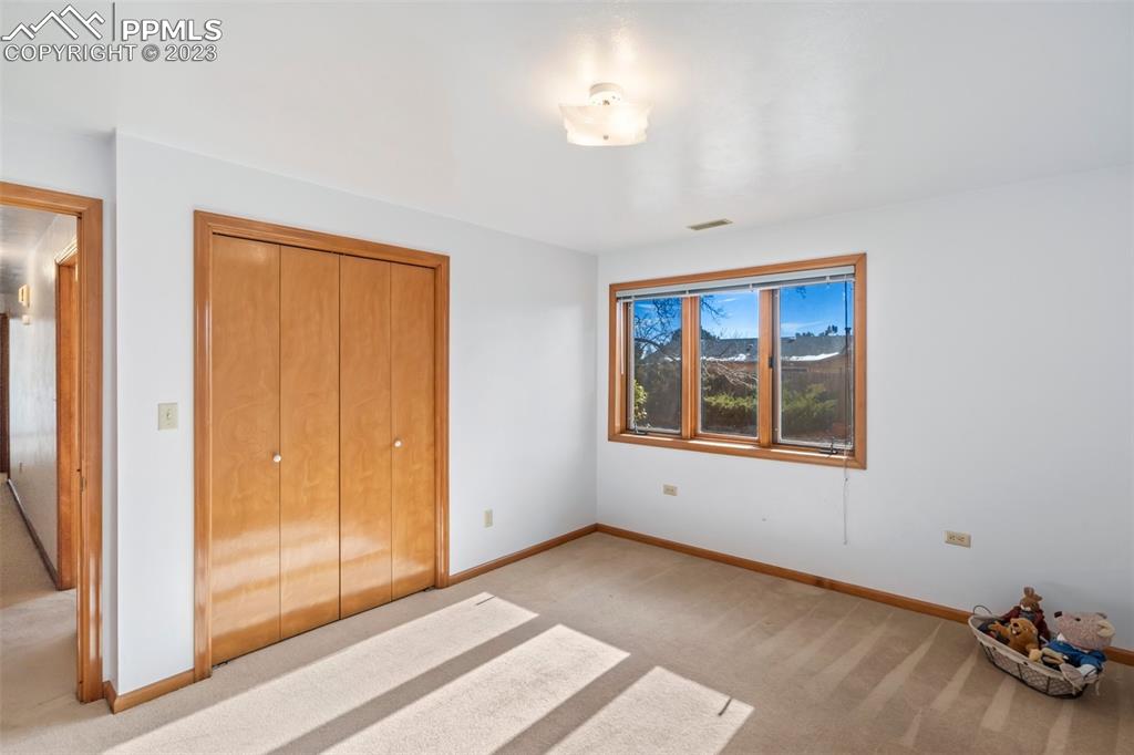 1711 Columbine Road Colorado Springs, CO 80907 - Photo 27 of 50 a view of an empty room with a window