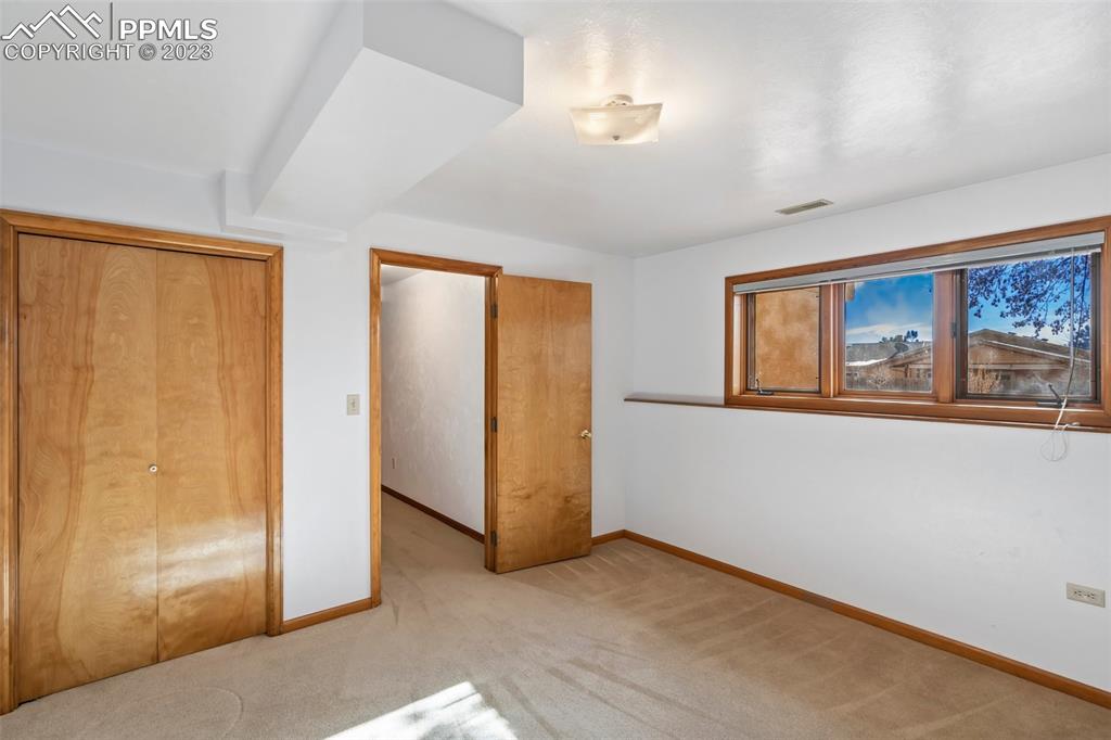 1711 Columbine Road Colorado Springs, CO 80907 - Photo 29 of 50 a view of an empty room with a window