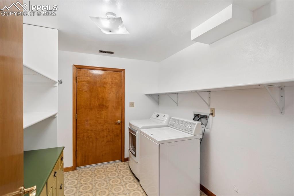 1711 Columbine Road Colorado Springs, CO 80907 - Photo 32 of 50 a utility room with dryer and washer