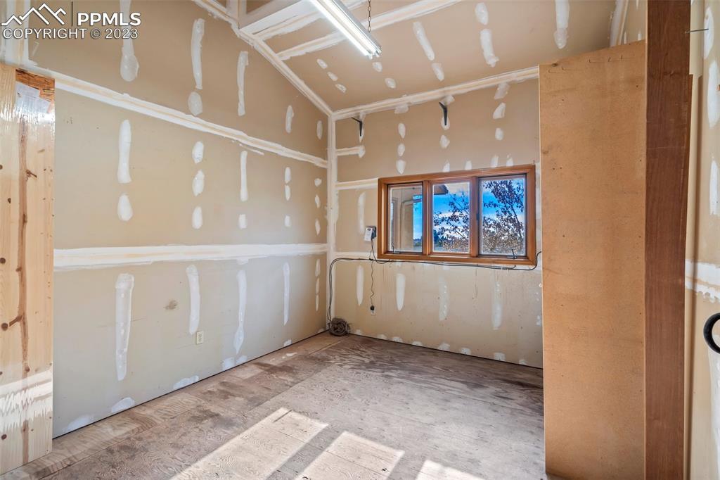 1711 Columbine Road Colorado Springs, CO 80907 - Photo 33 of 50 a view of a hallway with wooden floor and windows