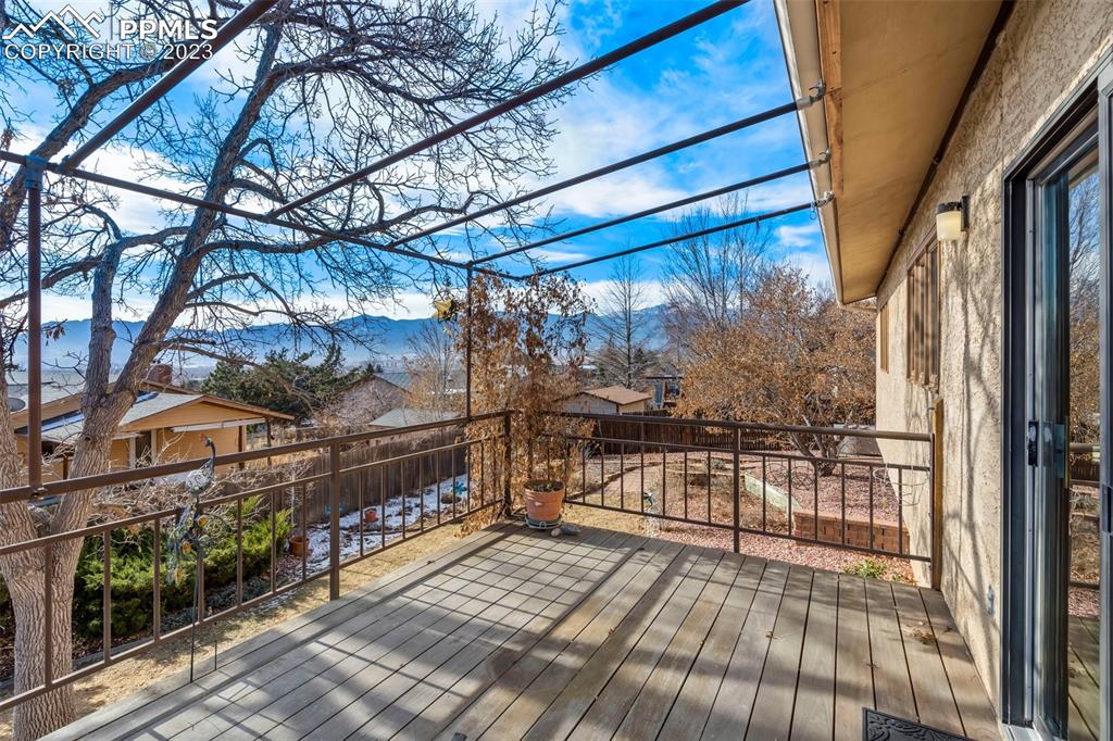1711 Columbine Road Colorado Springs, CO 80907 - Photo 35 of 50 a view of balcony with wooden floor and outdoor space