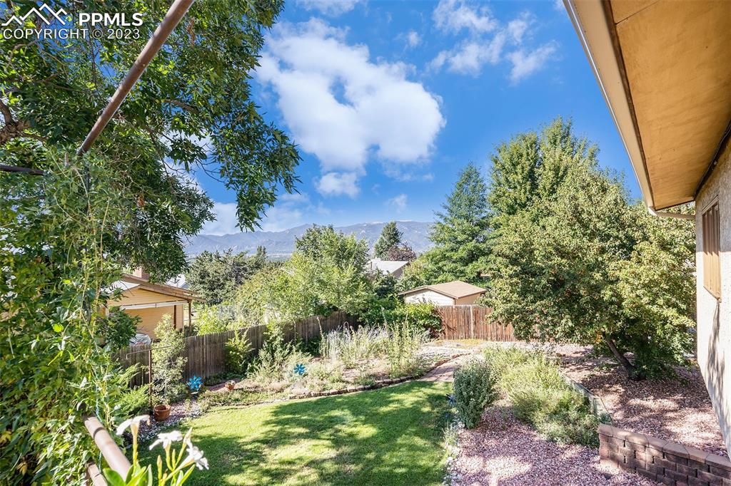 1711 Columbine Road Colorado Springs, CO 80907 - Photo 43 of 50 a backyard of a house with a yard