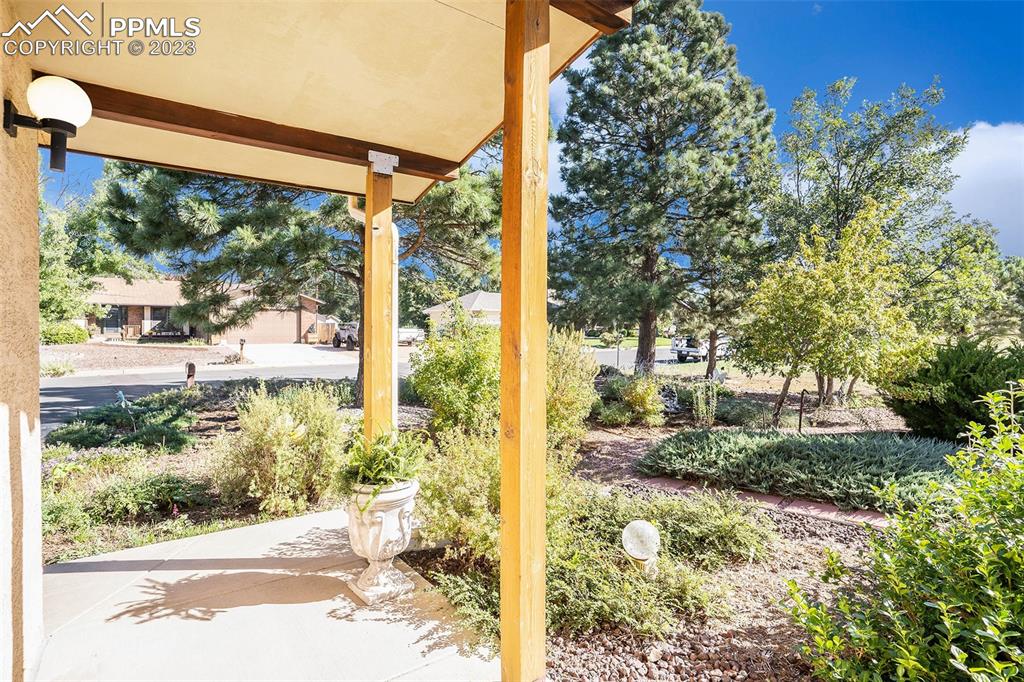 1711 Columbine Road Colorado Springs, CO 80907 - Photo 44 of 50 a view of a porch and garden