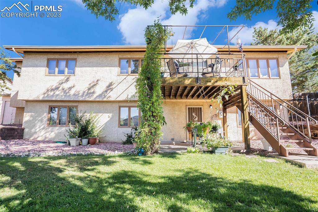 1711 Columbine Road Colorado Springs, CO 80907 - Photo 46 of 50 a front view of a house with a yard