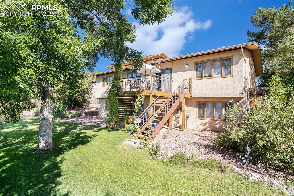 1711 Columbine Road Colorado Springs, CO 80907 - Photo 47 of 50 a view of a house with a yard