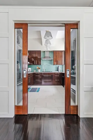 a kitchen with stainless steel appliances granite countertop a sink and cabinets