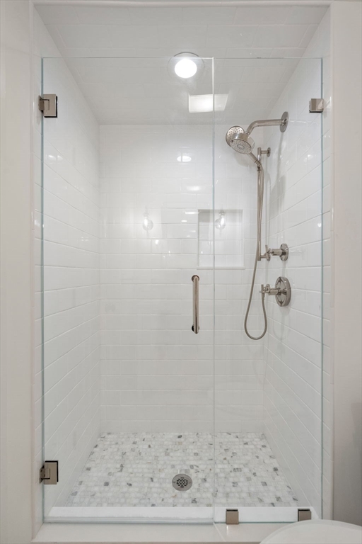75 Grove Street, Unit 429 Wellesley, MA 02482 - Photo 14 of 22 a bathroom with a shower