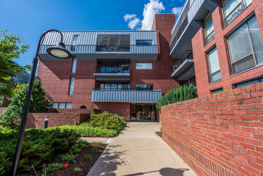 75 Grove Street, Unit 429 Wellesley, MA 02482 - Photo 21 of 22 a front view of a building