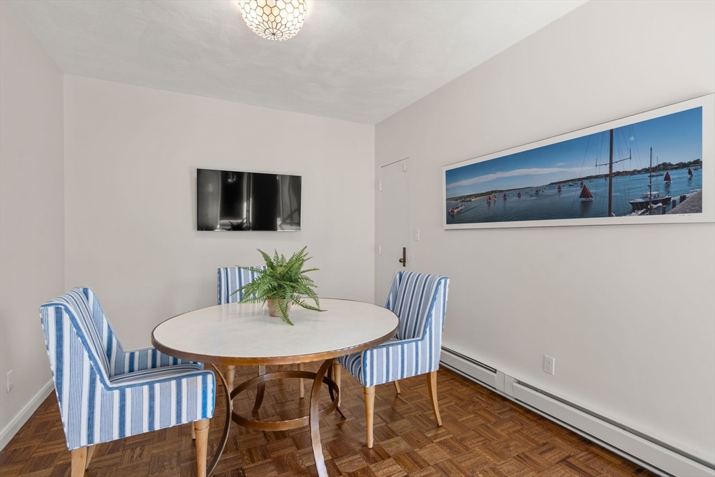 75 Grove Street, Unit 429 Wellesley, MA 02482 - Photo 5 of 22 a view of a dining room with furniture