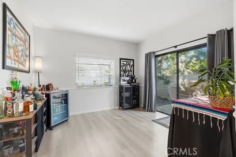 a bedroom with furniture and large window
