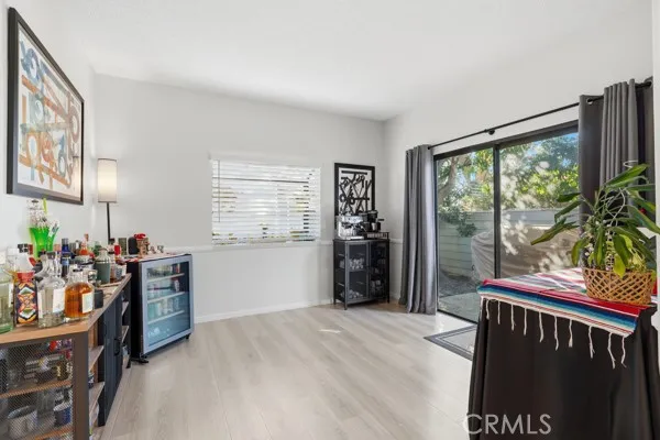 a bedroom with furniture and large window