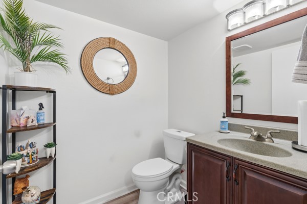 442 Walker Road San Dimas, CA 91773 - Photo 25 of 48 a bathroom with a toilet a sink and a mirror