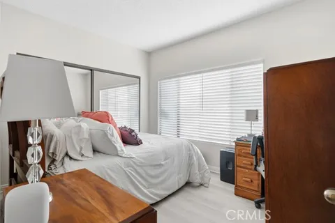 a bedroom with furniture and a window