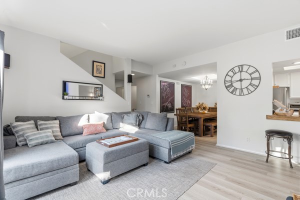 442 Walker Road San Dimas, CA 91773 - Photo 3 of 48 a living room with furniture a clock on wall and a window