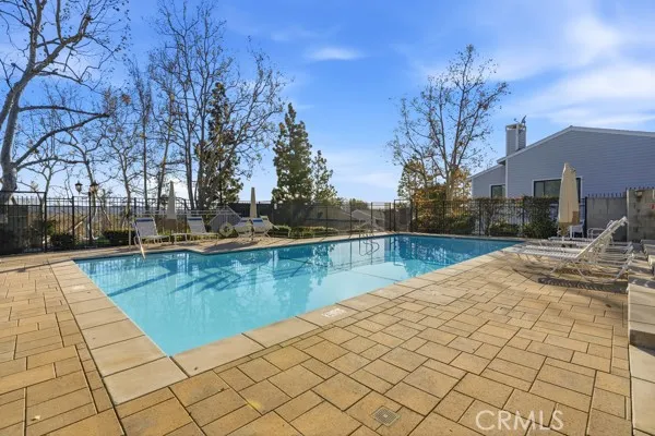a view of a swimming pool with a patio