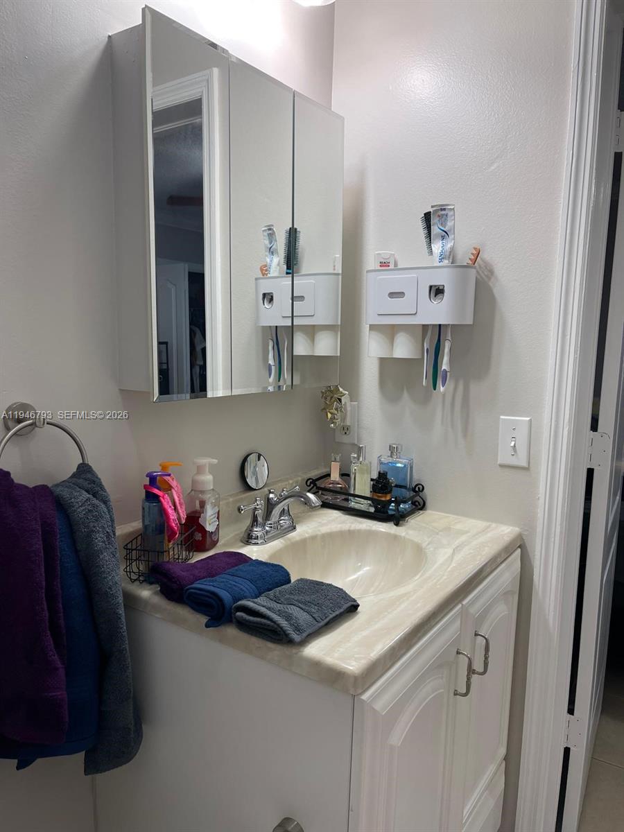 527 West 68th Street, Unit 1 Hialeah, FL 33014 - Photo 7 of 7 a kitchen with stainless steel appliances a sink and cabinets