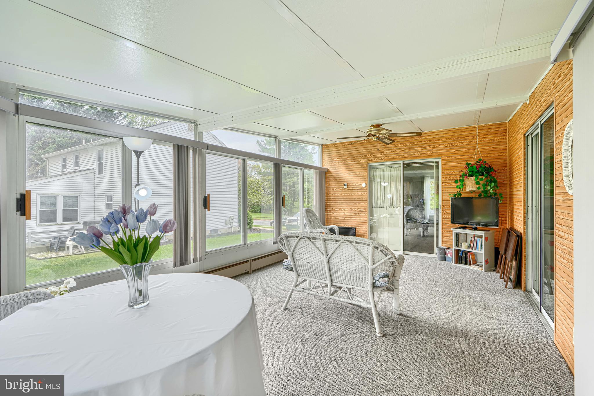 9405 Perglen Road Nottingham, MD 21236 - Photo 17 of 36 a dining room with furniture and large windows
