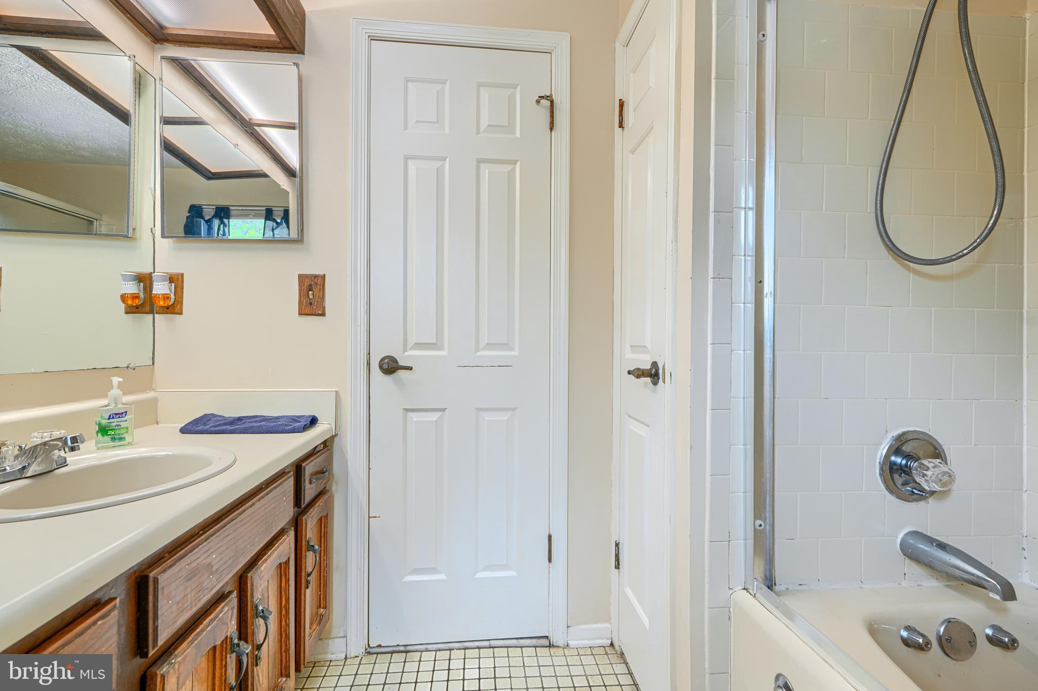 9405 Perglen Road Nottingham, MD 21236 - Photo 20 of 36 a bathroom with a tub sink and mirror