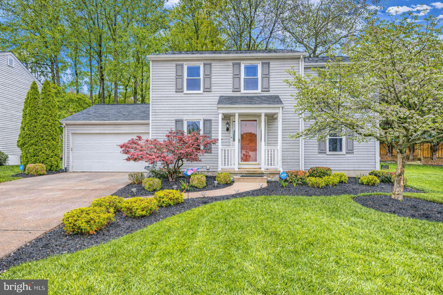9405 Perglen Road Nottingham, MD 21236 - Photo 2 of 36 a front view of a house with a yard and garage