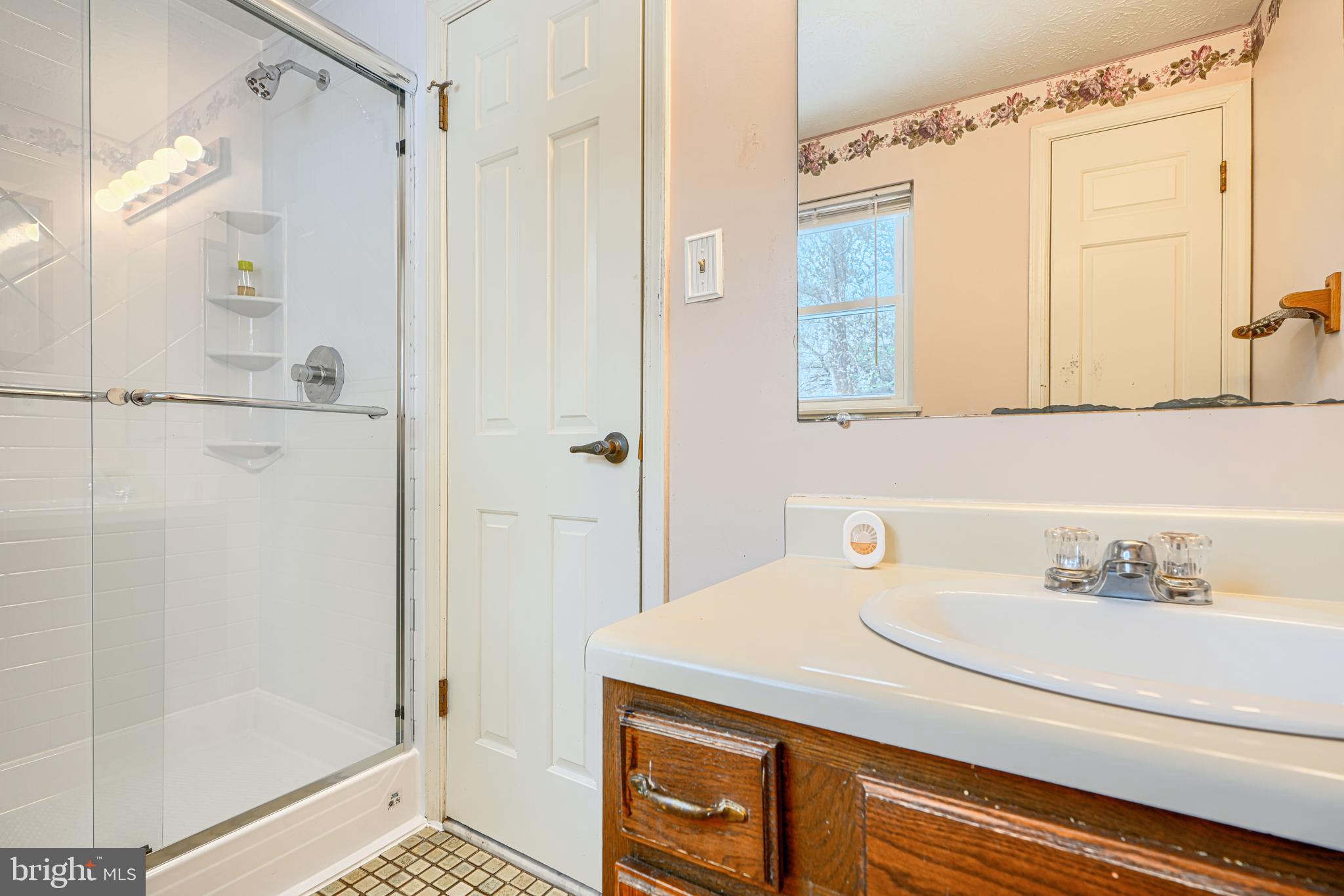 9405 Perglen Road Nottingham, MD 21236 - Photo 24 of 36 a bathroom with a sink and a mirror