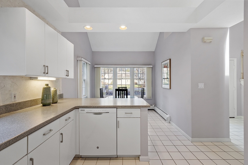 34 Pickman Drive, Unit 34 Bedford, MA 01730 - Photo 19 of 38 a kitchen with sink and cabinets