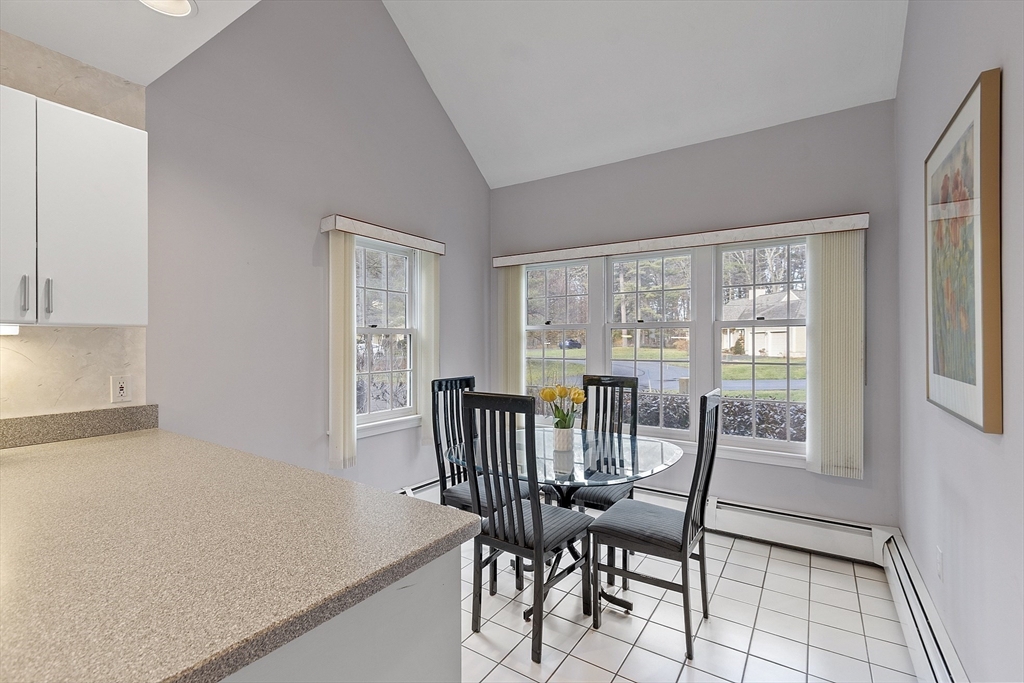 34 Pickman Drive, Unit 34 Bedford, MA 01730 - Photo 22 of 38 a view of a dining room with furniture window and outside view