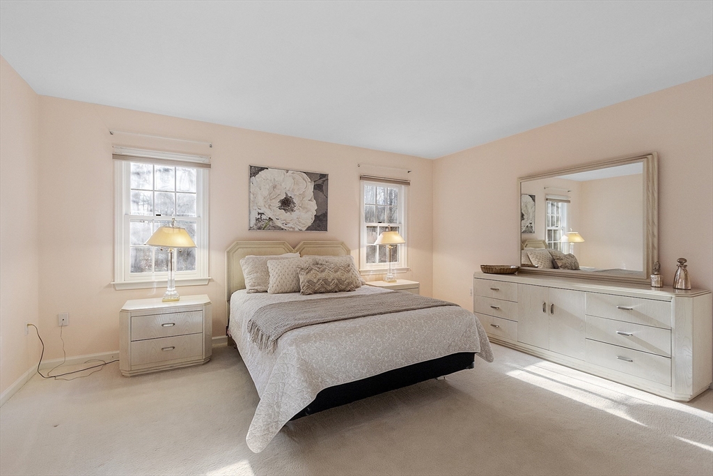 34 Pickman Drive, Unit 34 Bedford, MA 01730 - Photo 25 of 38 a spacious bedroom with a bed and window
