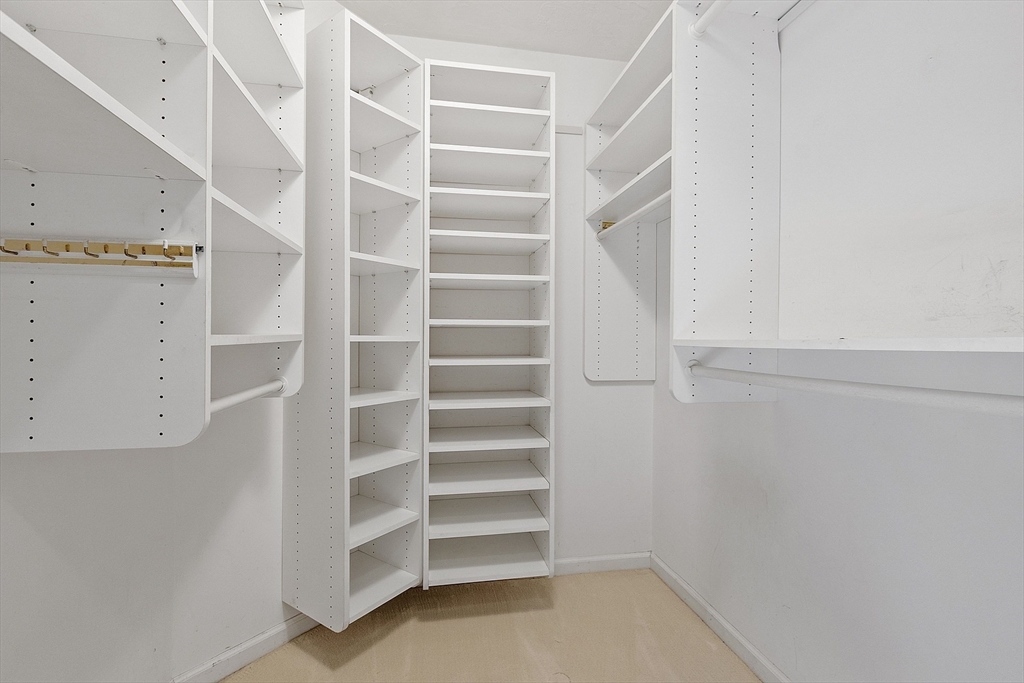 34 Pickman Drive, Unit 34 Bedford, MA 01730 - Photo 27 of 38 a view of walk in closet with empty racks