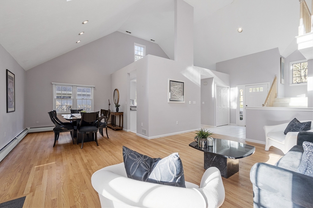 34 Pickman Drive, Unit 34 Bedford, MA 01730 - Photo 10 of 38 a living room with furniture dining table and a window
