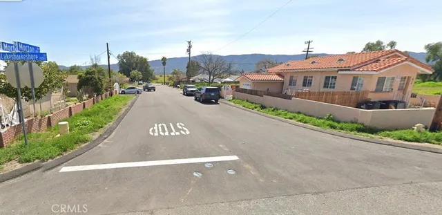 a front view of a house with a garden and pathway