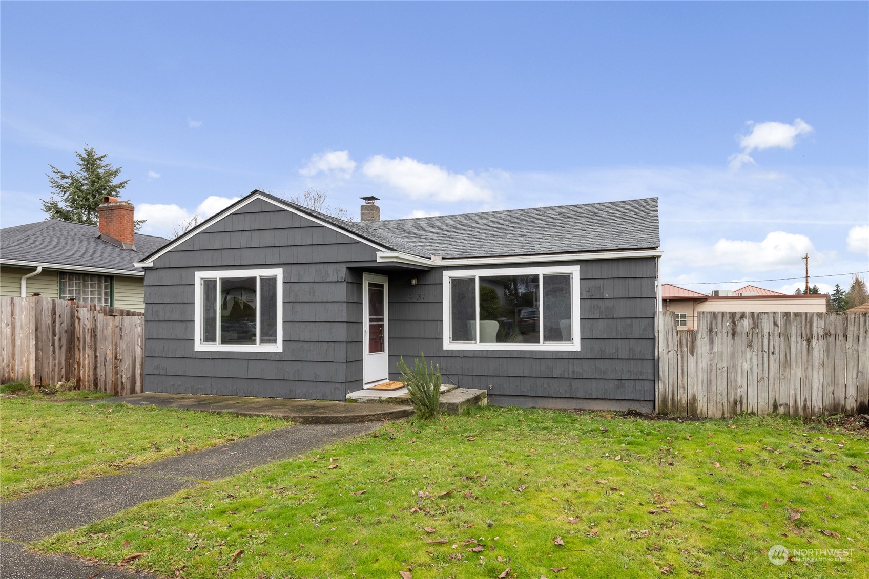 5037 South State Street Tacoma, WA 98409 - Photo 1 of 40 a front view of a house with garden