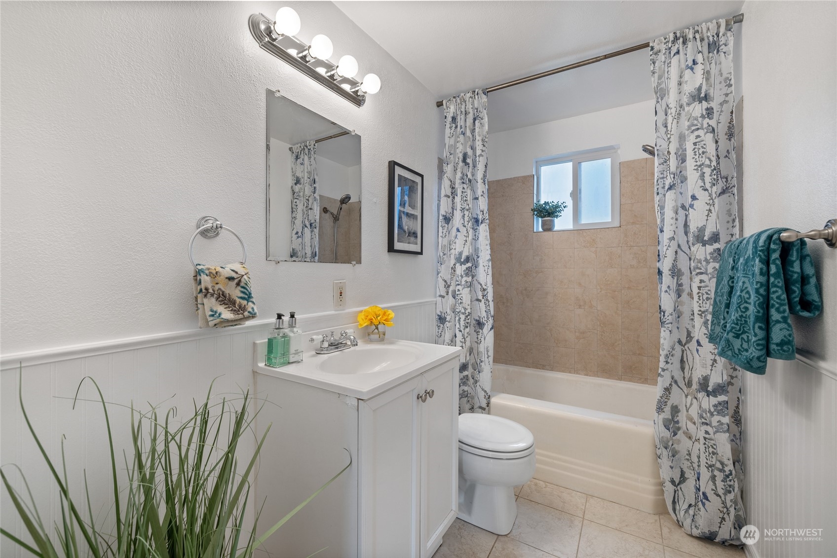 5037 South State Street Tacoma, WA 98409 - Photo 19 of 40 a bathroom with a sink a toilet and shower