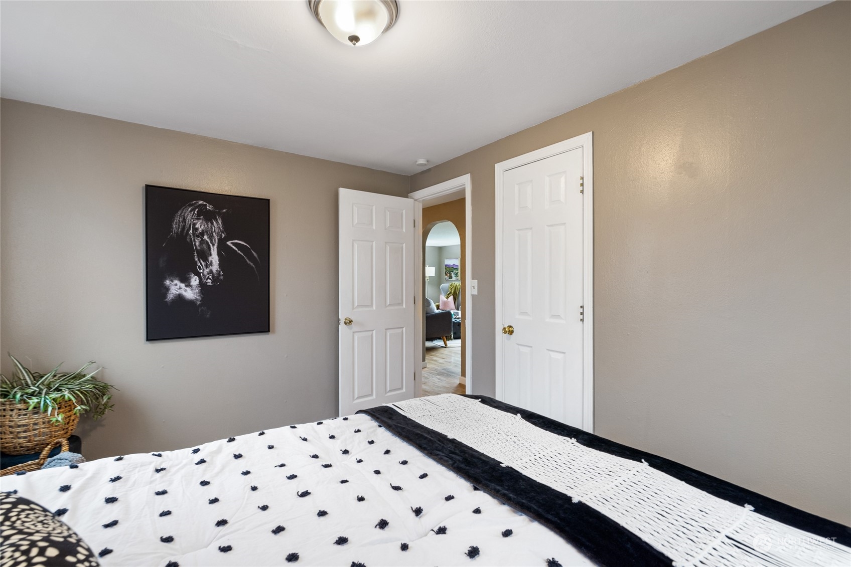 5037 South State Street Tacoma, WA 98409 - Photo 23 of 40 a bedroom with a bed and a painting on the wall