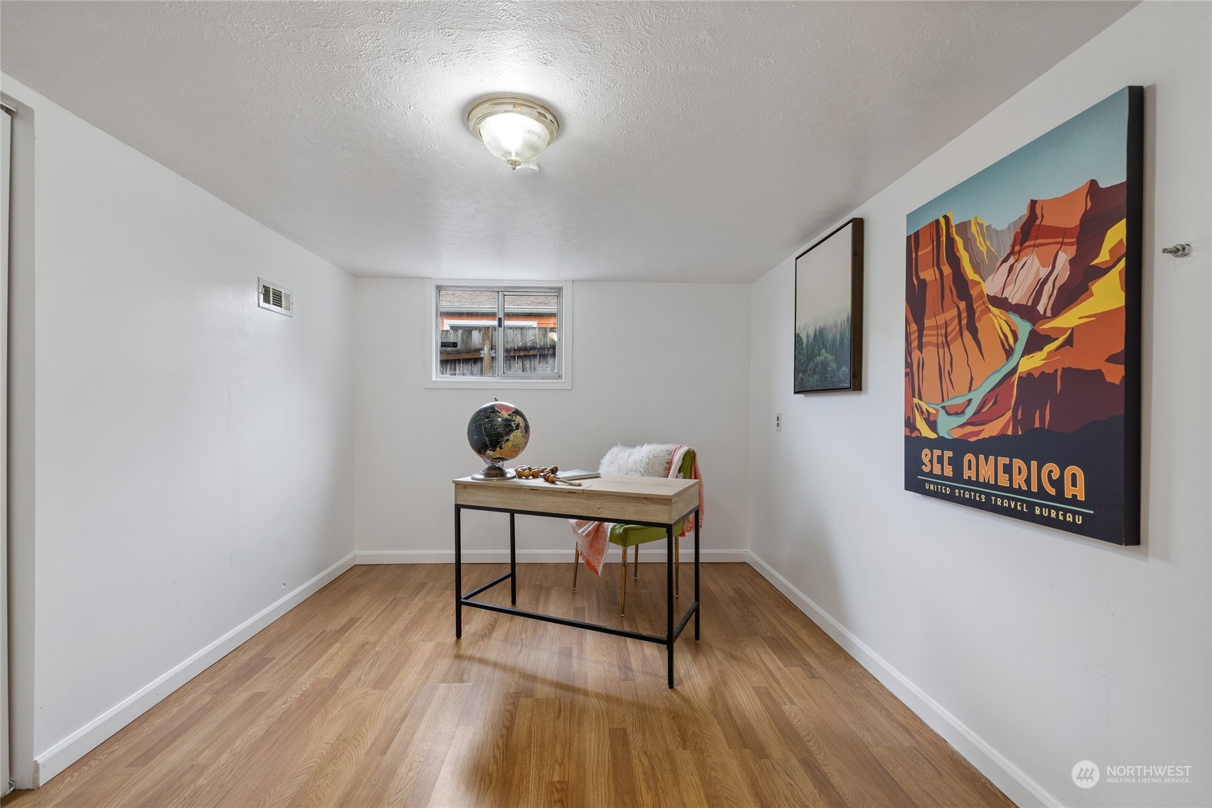 5037 South State Street Tacoma, WA 98409 - Photo 25 of 40 a view of a workspace with furniture and wooden floor