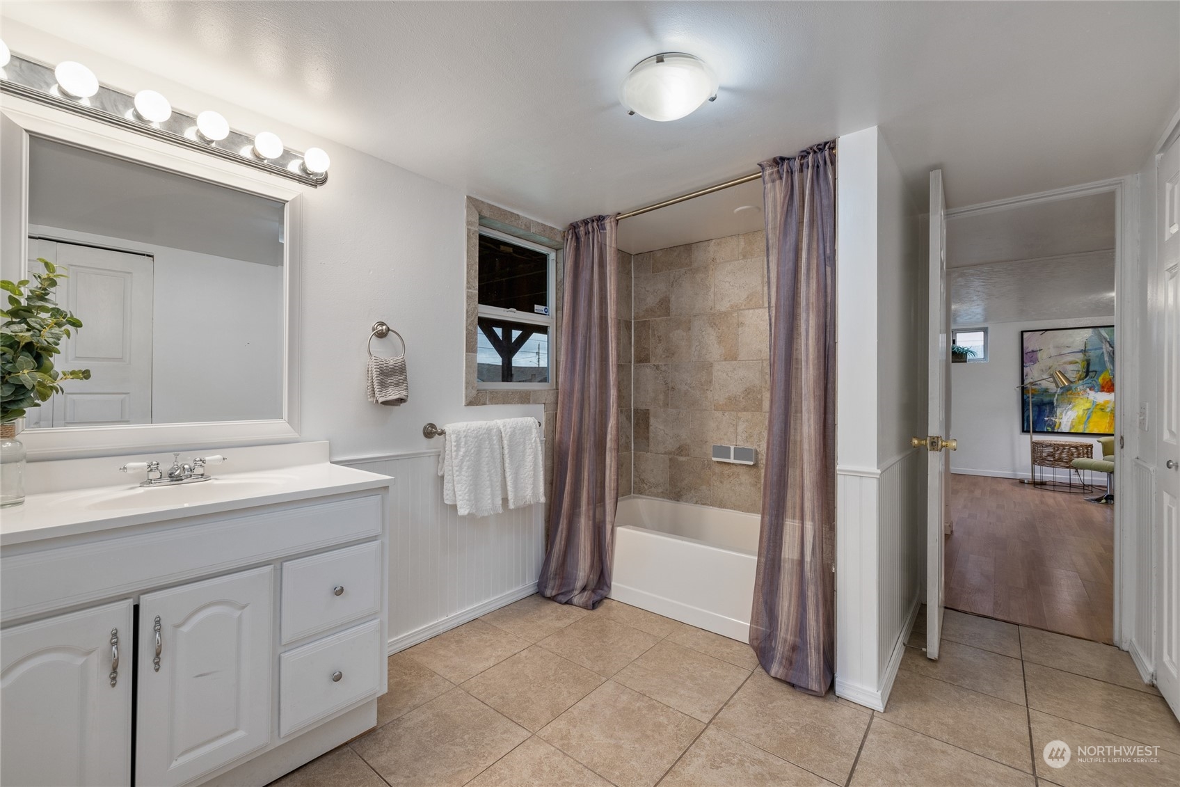 5037 South State Street Tacoma, WA 98409 - Photo 29 of 40 a spacious bathroom with a shower sink and mirror