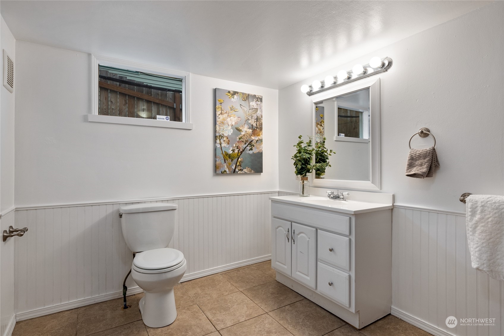 5037 South State Street Tacoma, WA 98409 - Photo 30 of 40 a bathroom with a toilet sink and mirror