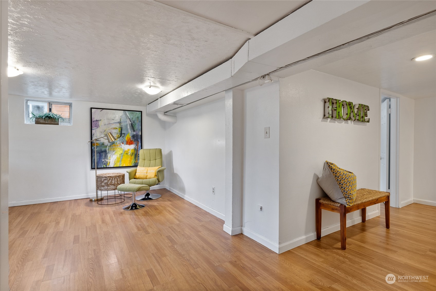 5037 South State Street Tacoma, WA 98409 - Photo 32 of 40 a view of a workspace with furniture and wooden floor