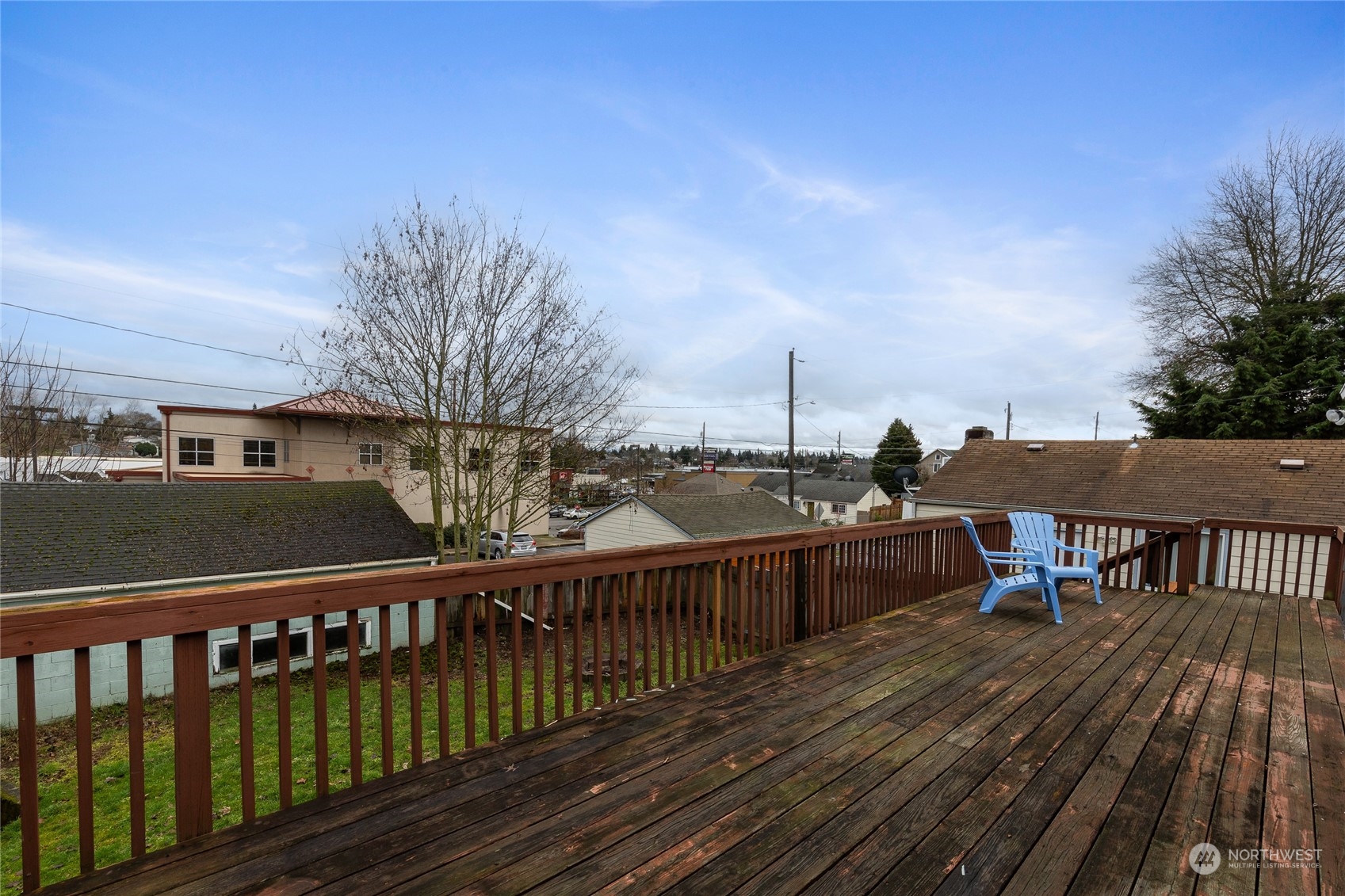 5037 South State Street Tacoma, WA 98409 - Photo 34 of 40 a view of a balcony with wooden floor and iron fence