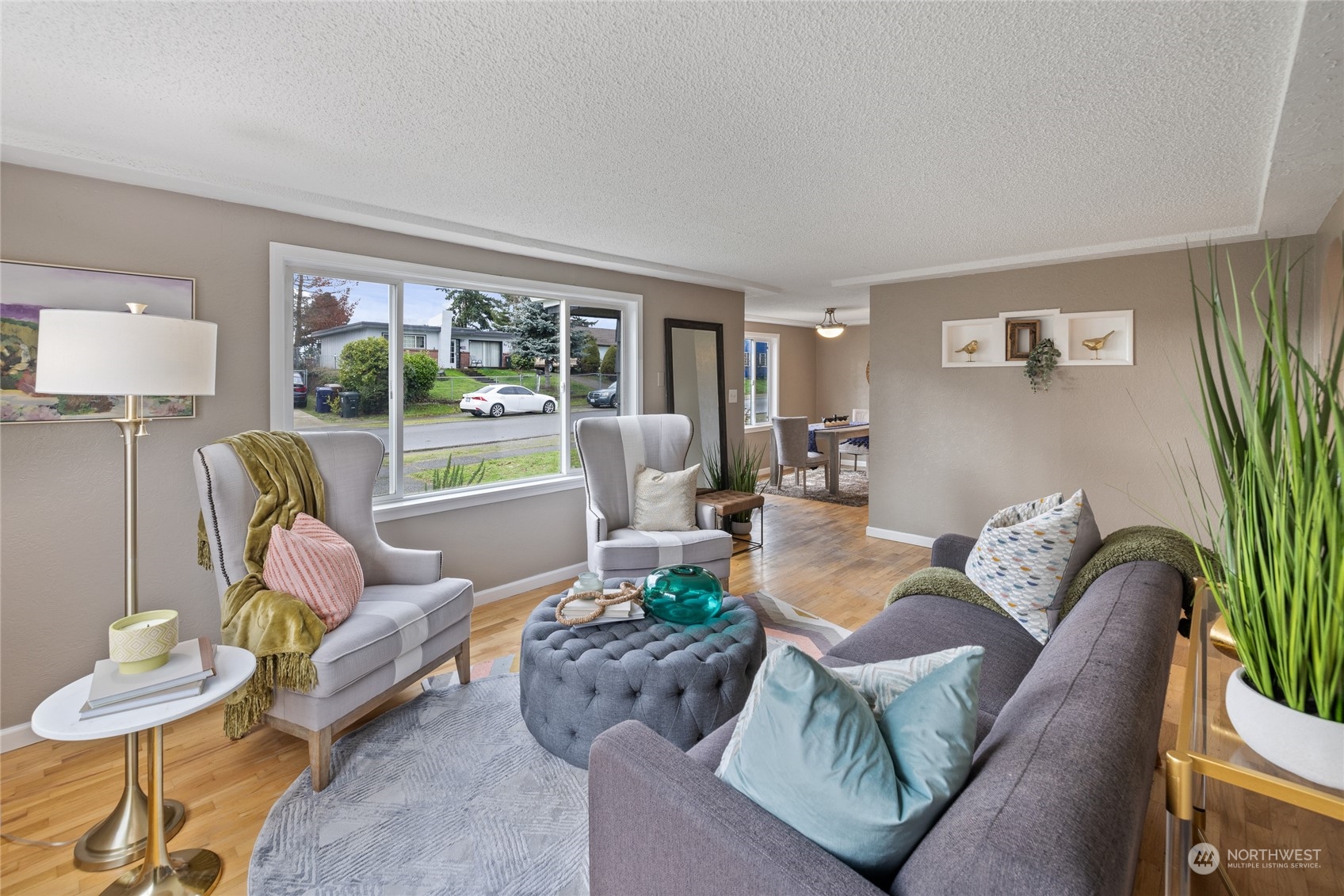 5037 South State Street Tacoma, WA 98409 - Photo 7 of 40 a living room with furniture and a large window