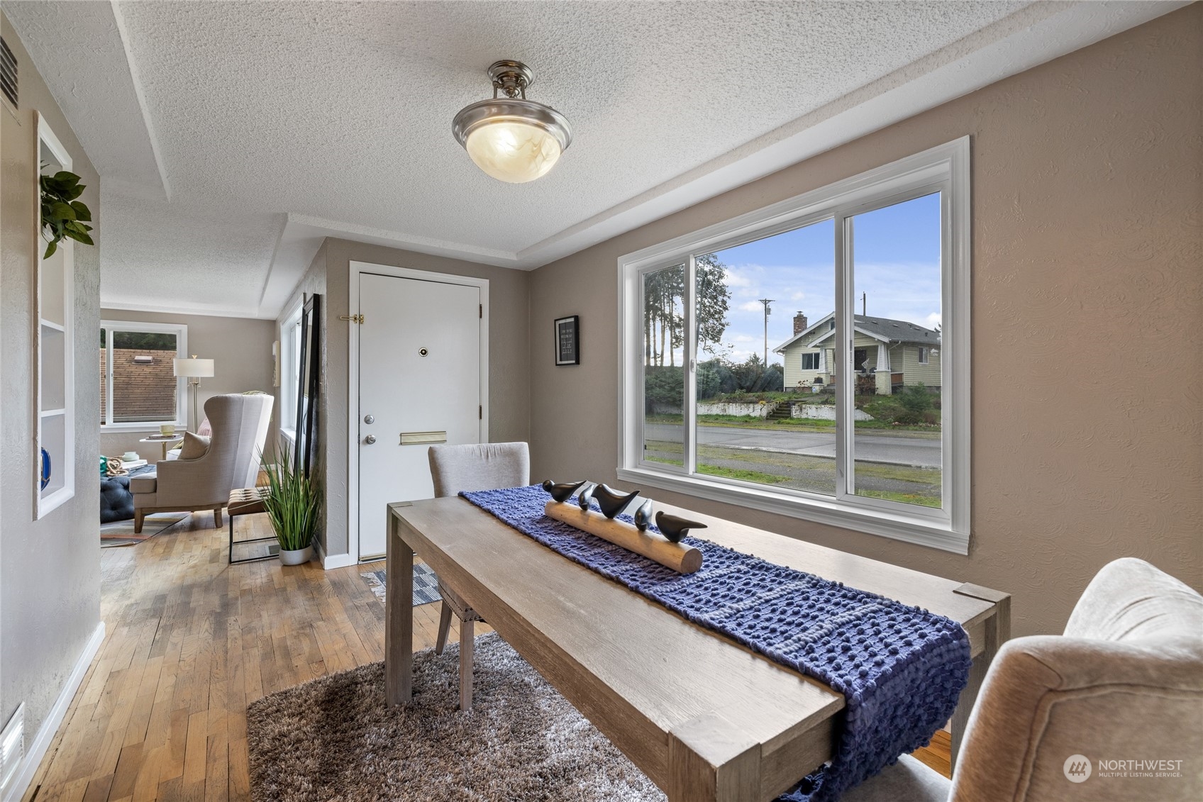 5037 South State Street Tacoma, WA 98409 - Photo 10 of 40 a living room with a couch and a table