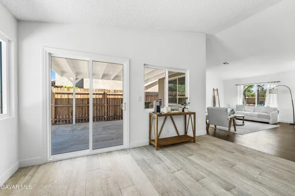 an empty room with glass door and glass door