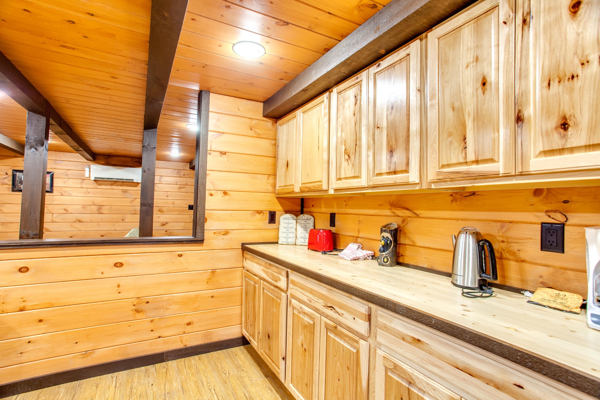 3769 Thomas Cross Road Sevierville, TN 37876 - Photo 23 of 40 a kitchen with stainless steel appliances a sink window and cabinets
