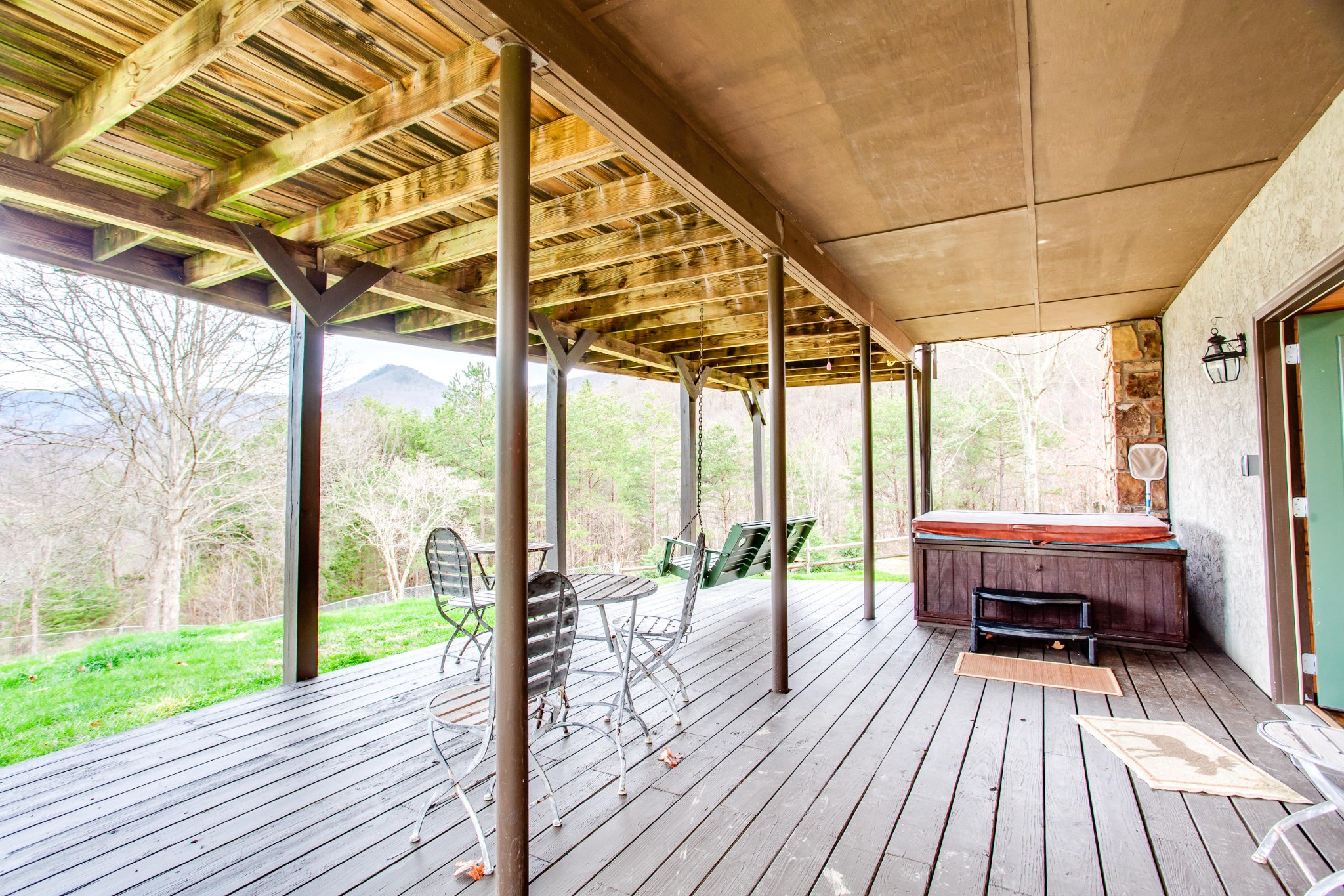 3769 Thomas Cross Road Sevierville, TN 37876 - Photo 30 of 40 a balcony with wooden floor table and chairs