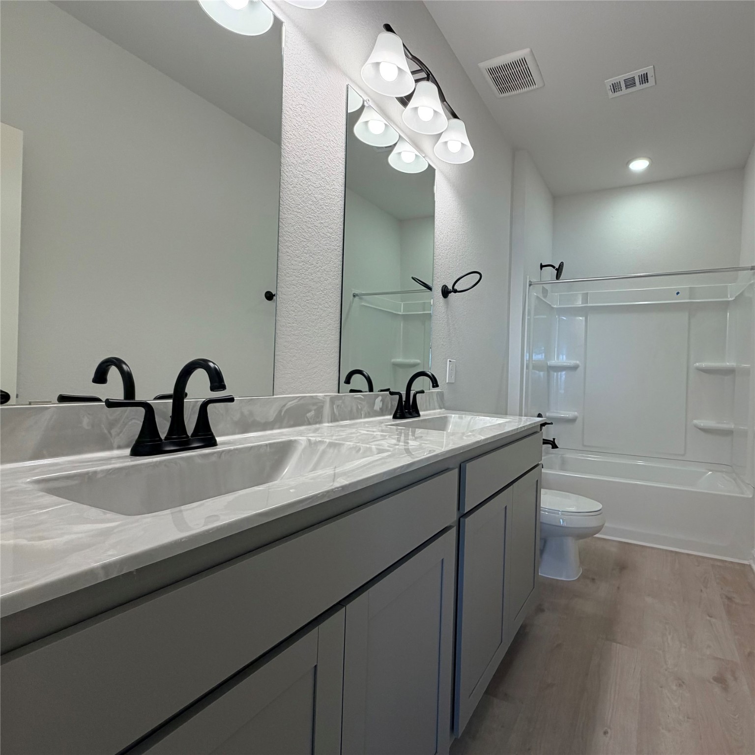 3418 Lago Norence Drive Manvel, TX 77578 - Photo 13 of 18 a bathroom with a double vanity sink and a bathtub
